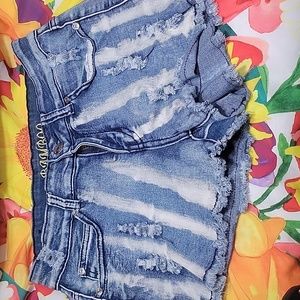 Super short distressed jean shorts with bleach lines.